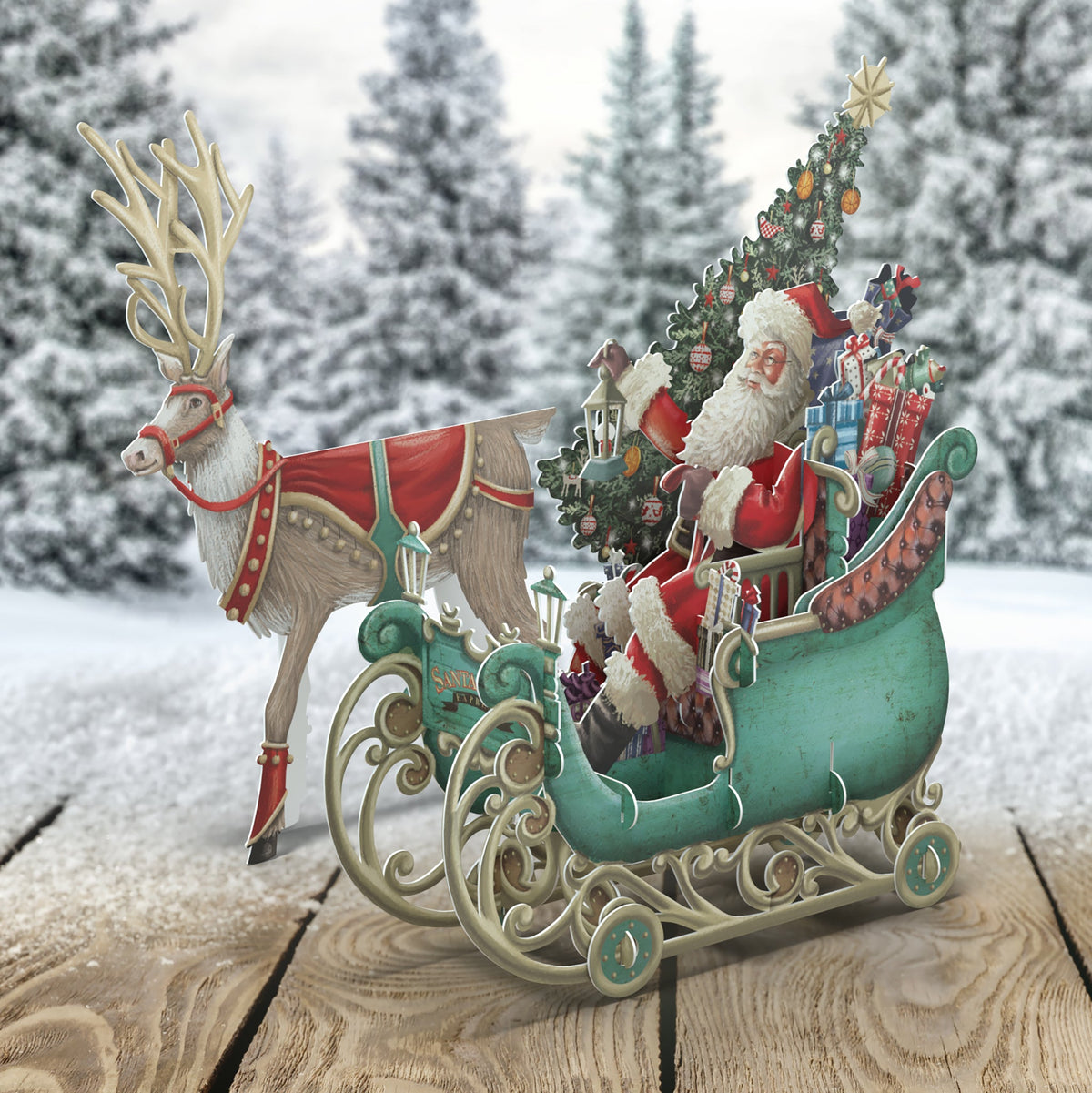 Santa’s Sleigh by Me&McQ, a three-dimensional Christmas card featuring Father Christmas in an ornate green sleigh laden with presents, beside a reindeer.