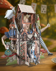 Pop-up book or toy with characters and scenic background on a wooden surface.