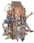 Cardboard cutout of Alice in Wonderland with a house on her head, featuring various elements like a stork, flowers, and a striped leg.
