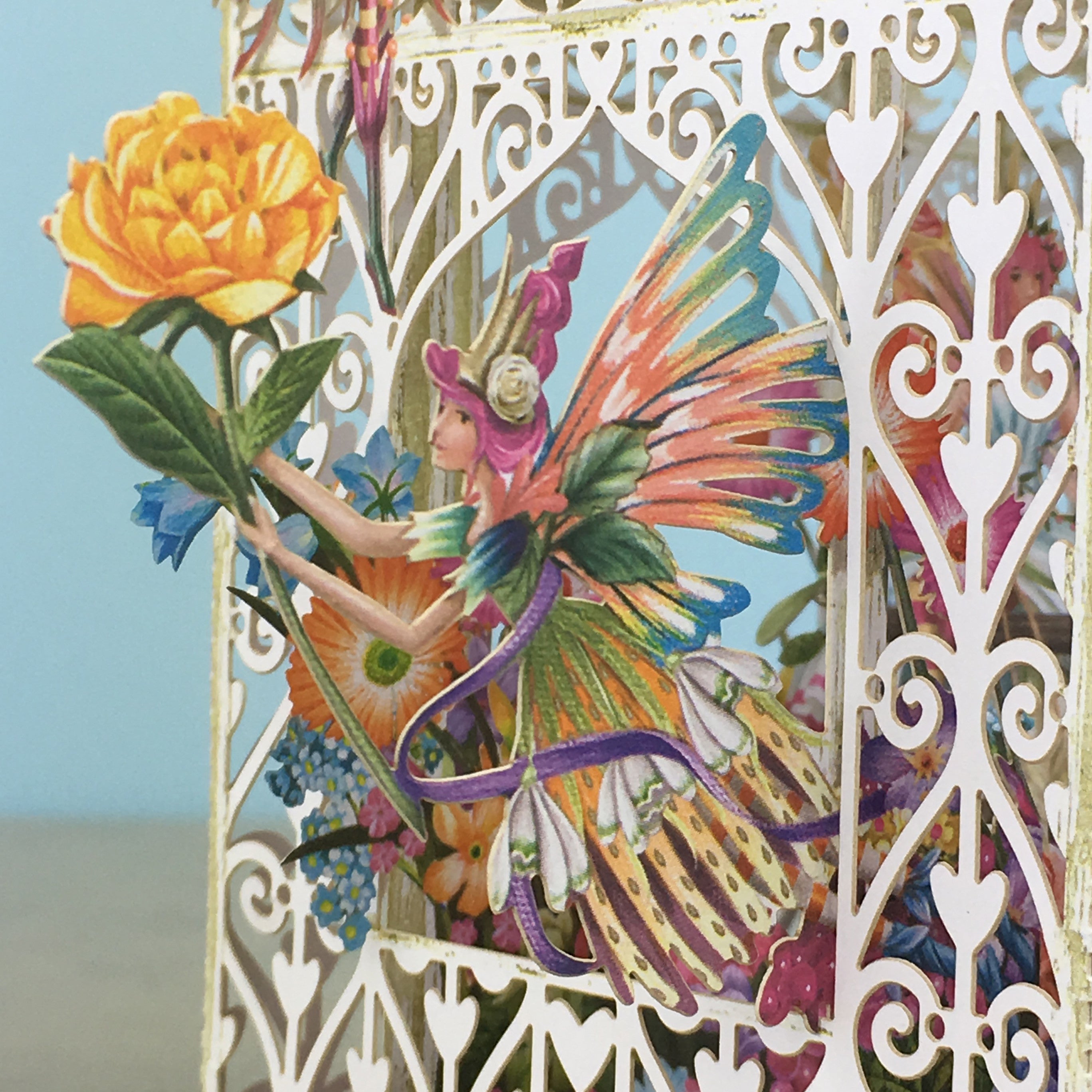 Flower Fairies play amongst flowers in laser cut paper birdcageby Me&amp;McQ